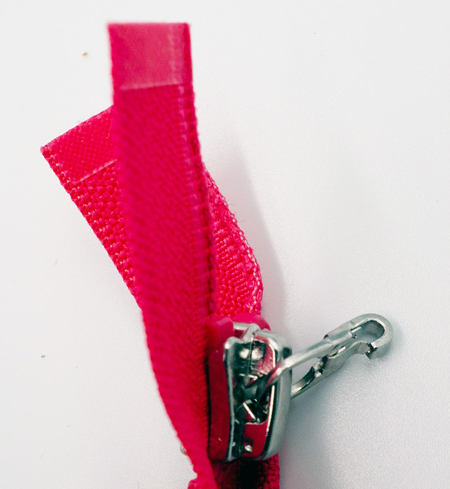 Plastic Zipper: 2-Way / Open End / Plastic Teeth / Regular Heads x 2 / Teeth & Tape Colour is Hot Pink